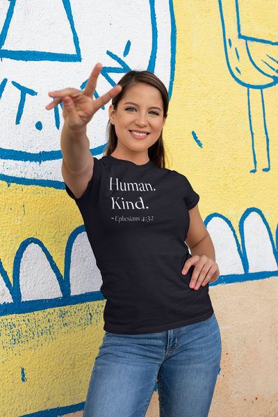 Woman wearing black Human Kind unisex t shirt